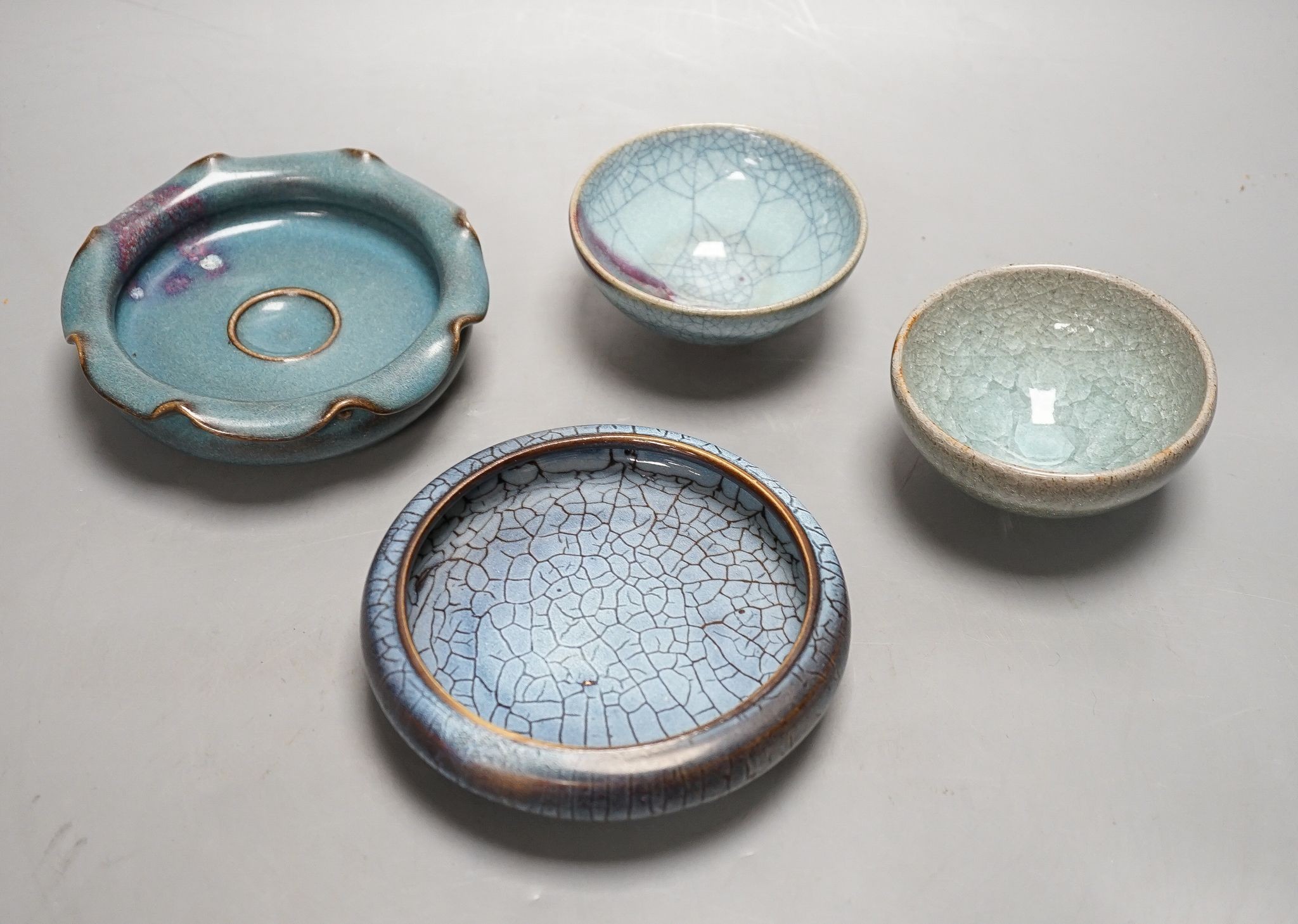 Four Chinese Jun type dishes/bowls, largest 14 cms diameter.
